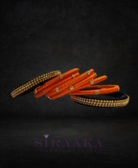 ORANGE BLACK SILK THREAD BANGLES